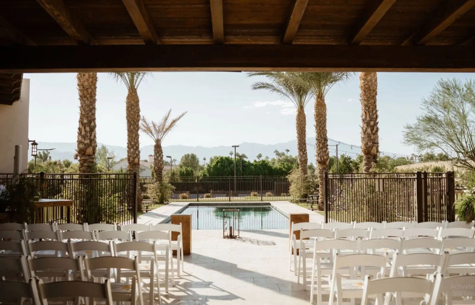 Ceremony setup with pool and mountain view