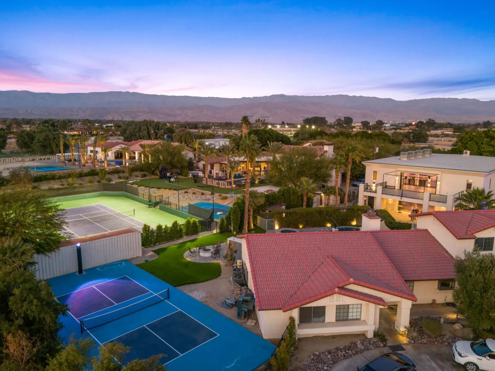 Tennis court with mountain views at twilight