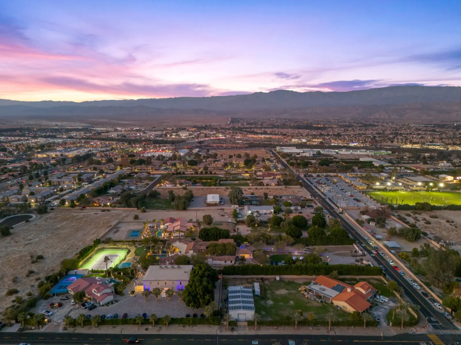 Wide aerial view of the estate at dusk