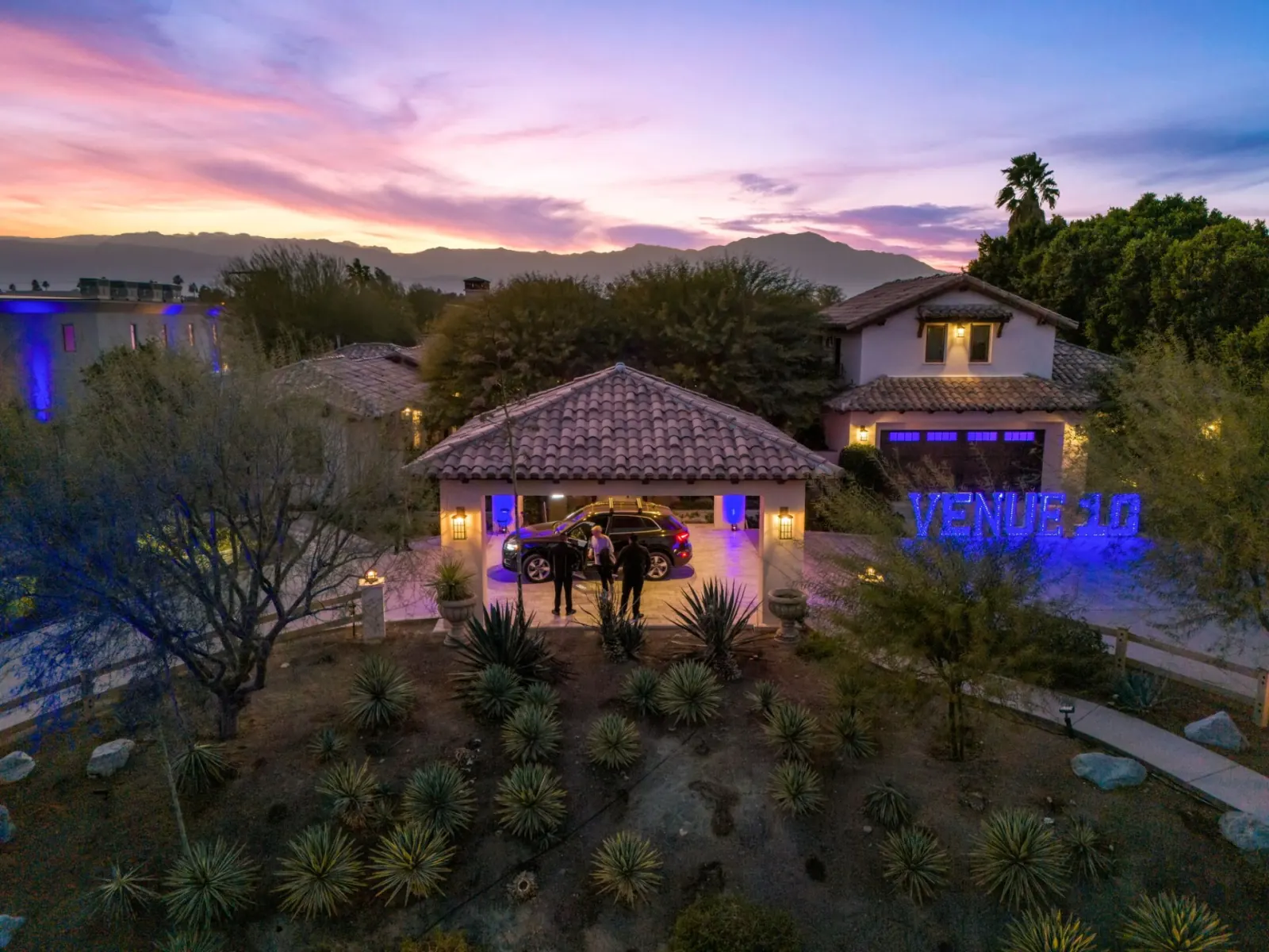VENUE 10 illuminated entrance at sunset