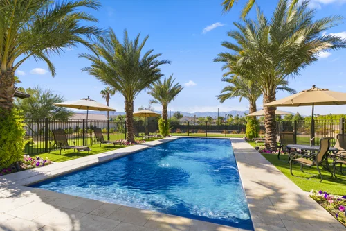 Pool with palms and mountain views