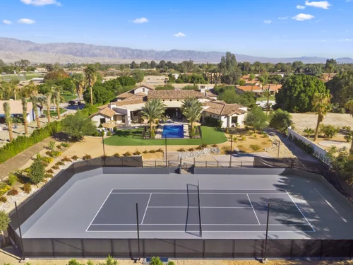 Private tennis court with mountain backdrop